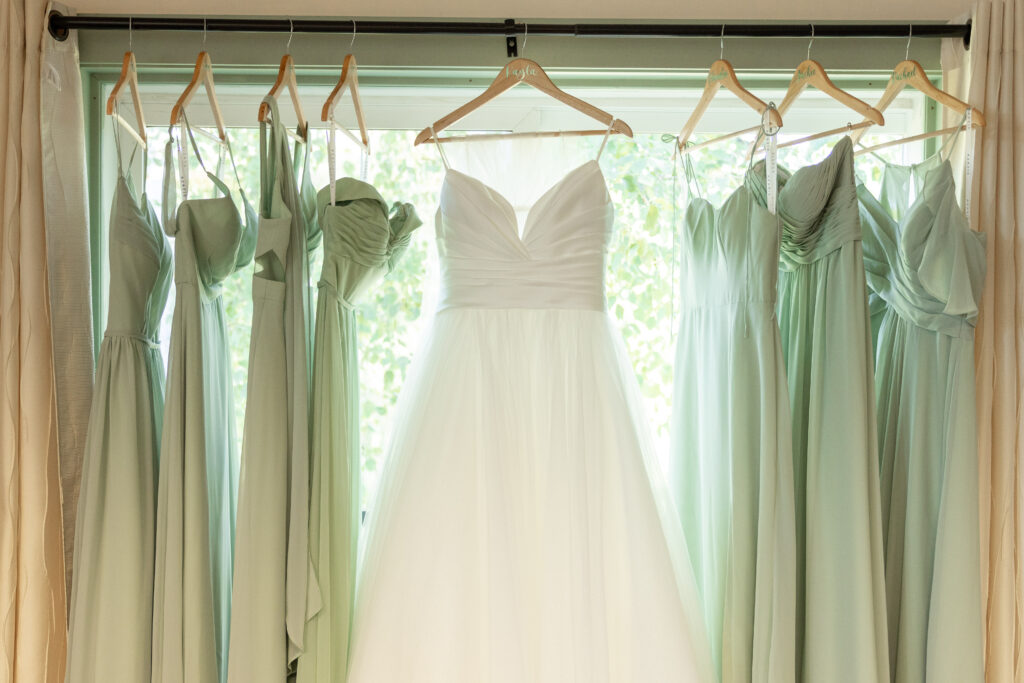 wedding dress and bridesmaid dresses lined up