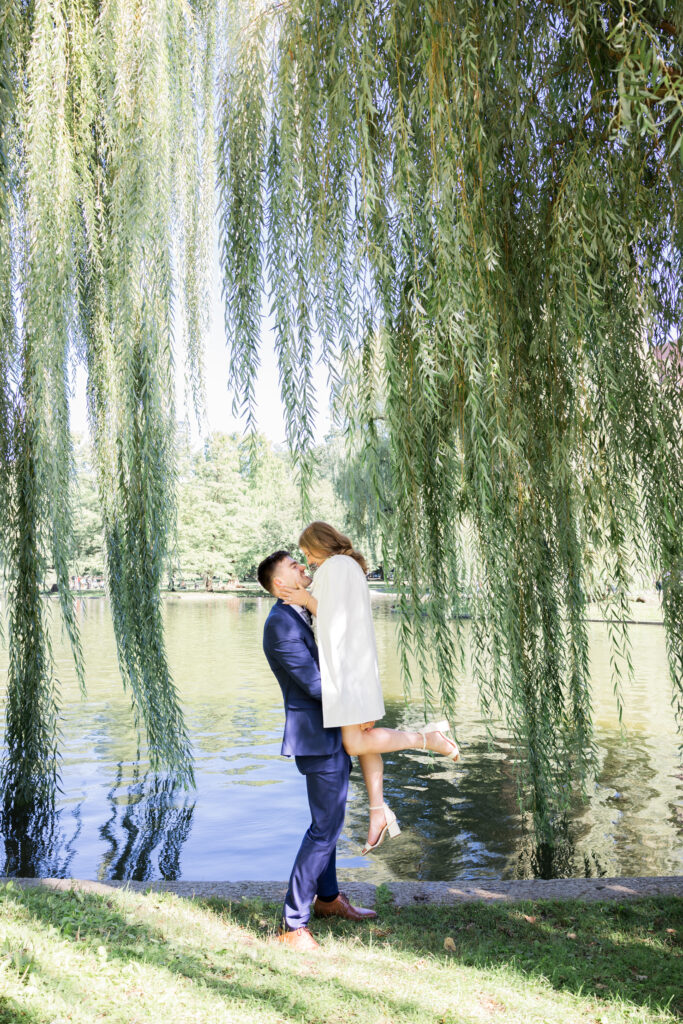 Couple elopes in the Boston commons by the willow trees