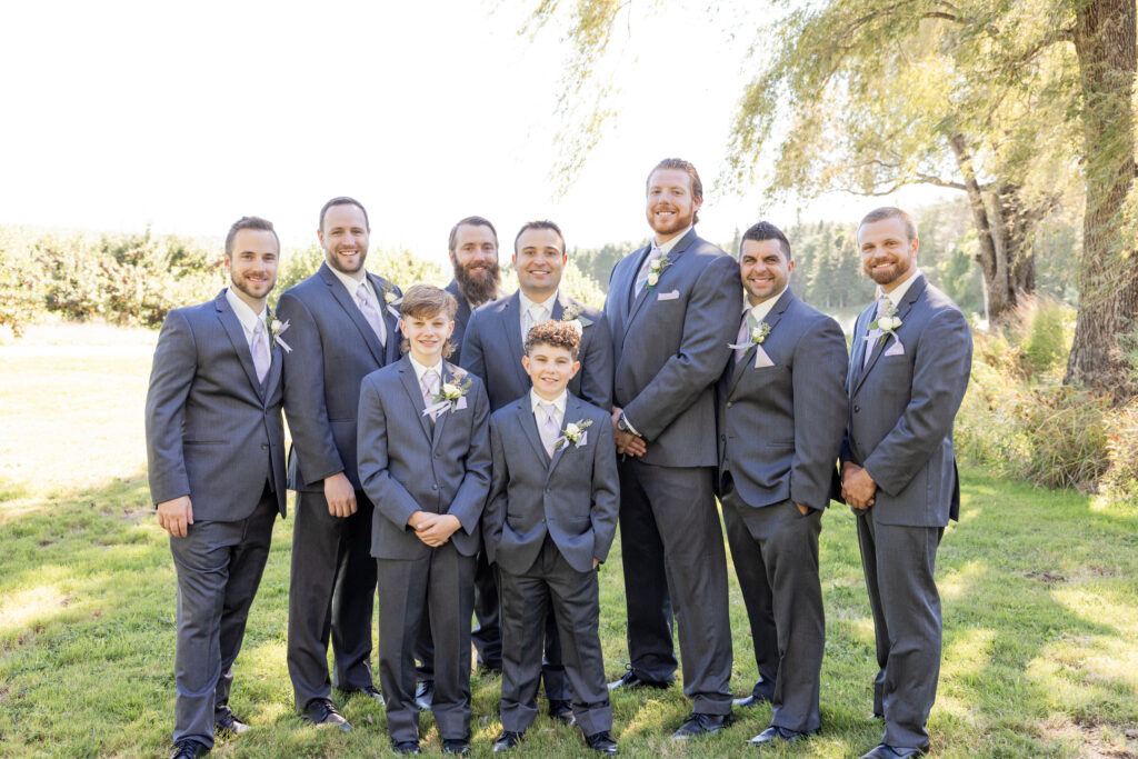 Portrait of groomsmen and the ring bearers with the groom