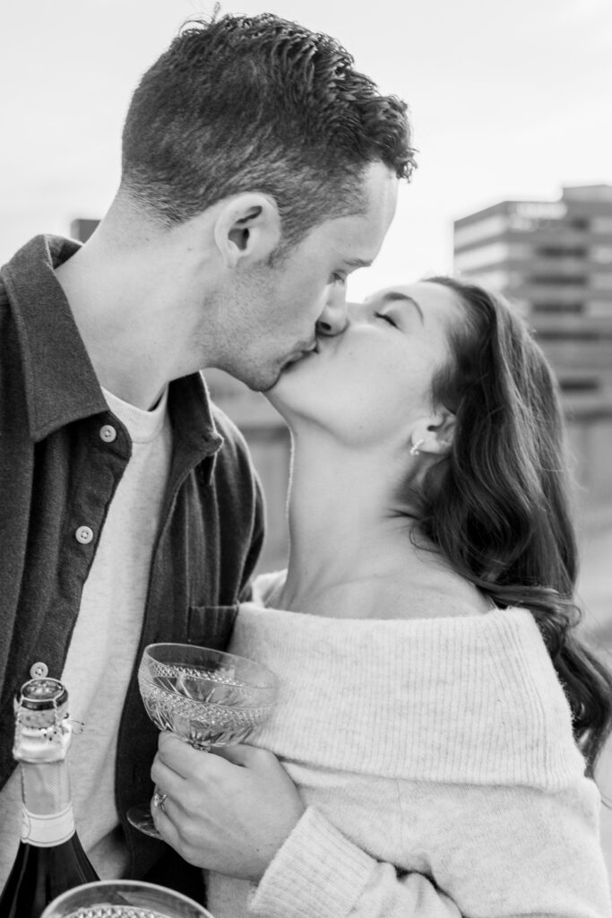 man and woman kiss during Boston engagement photos
