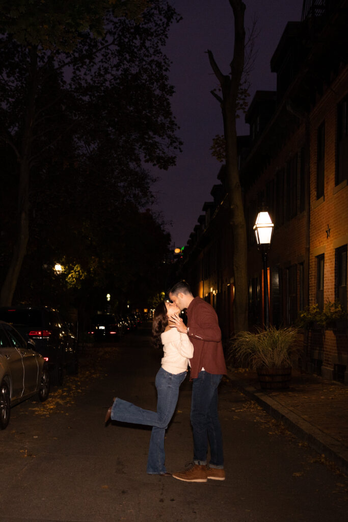 couple kisses outside of Delux cafe in South End Boston
