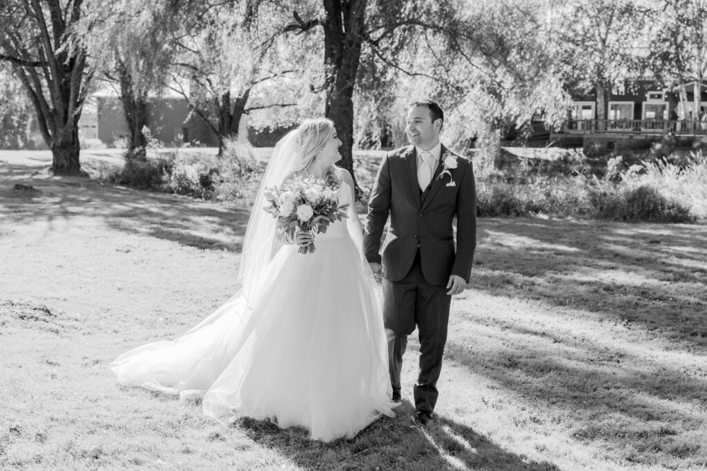 Candid wedding portraits of bride and groom in black and white