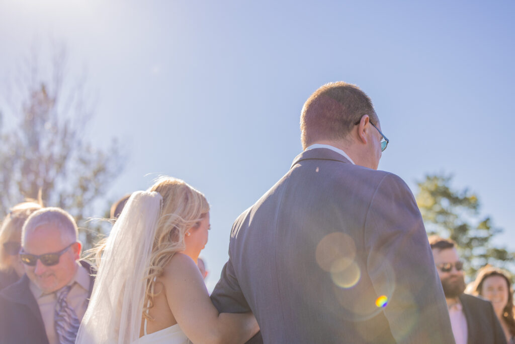 Father walking his daughter down the aisle for her wedding