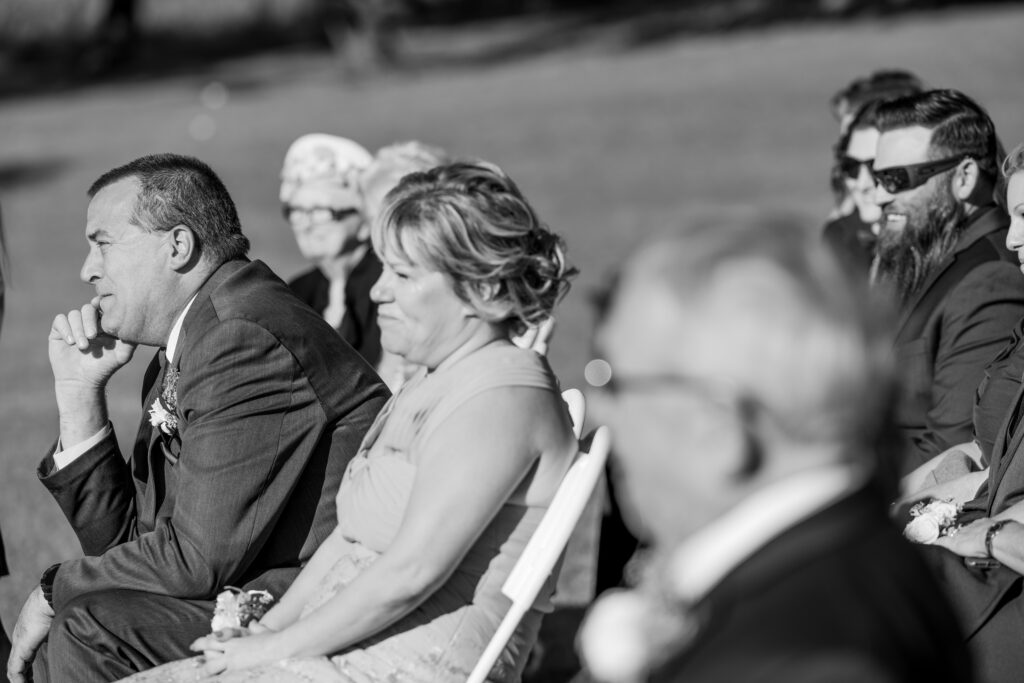 Emotional candid portrait of the bride's father during the wedding ceremony