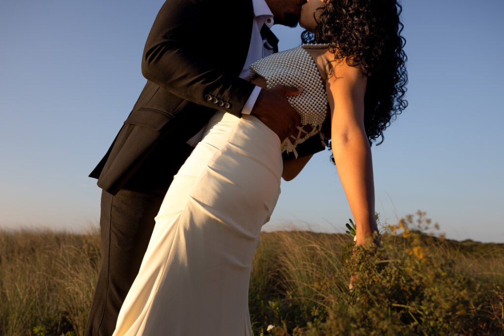 Intimate wedding ceremony on the beaches of block island at golden hour