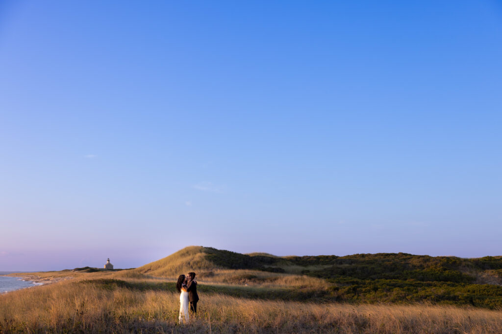 Intimate wedding portraits in the dunes of block island at golden hour