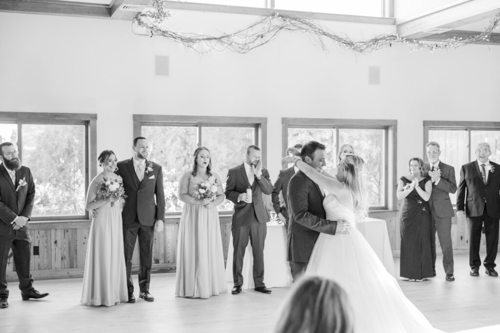 Bride and groom have their first dance in black and white