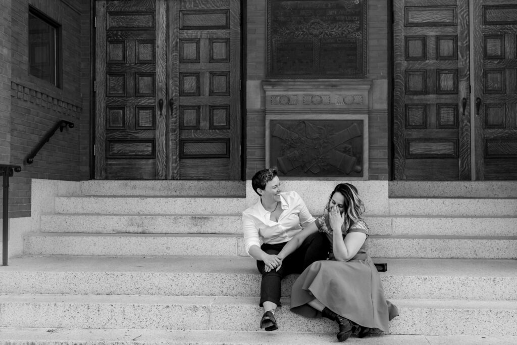 LGBTQIA+ couple elopes. Candid Wedding Portraits on the Steps of Belmont Town Hall