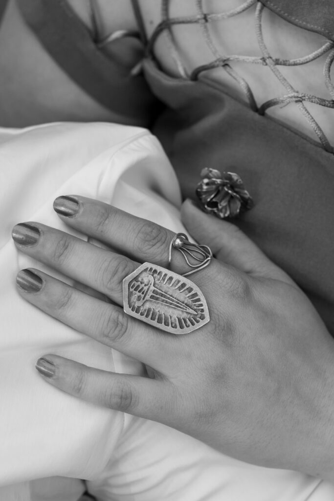 LGBTQIA+ couple elopes. Detail photo of their hands and rings in Black and white