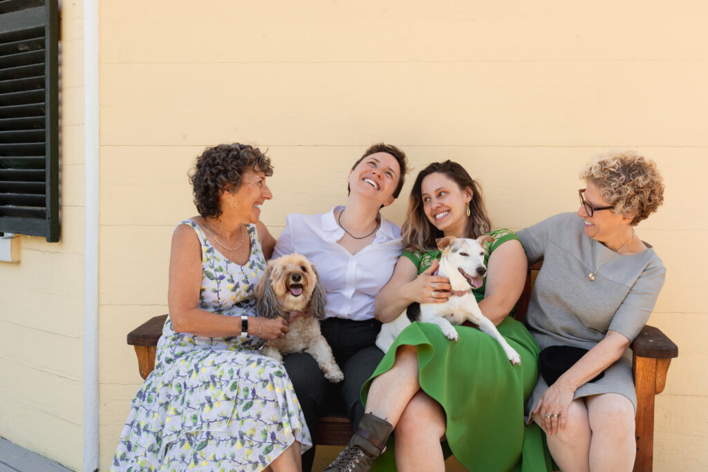 LGBTQIA+ couple elopes. Formal Wedding Family Portraits with dogs
