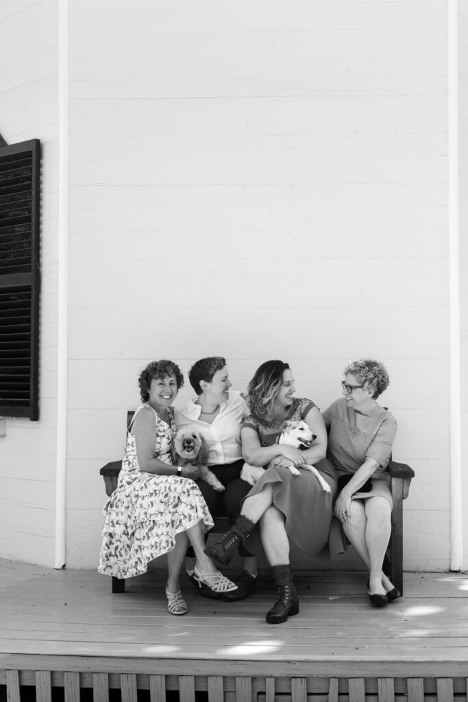LGBTQIA+ couple elopes. Candid Wedding Family Portraits with dogs, in black and white