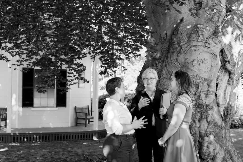 LGBTQIA+ couple elopes. Wedding Ceremony Photos at Wellington Station in black and white