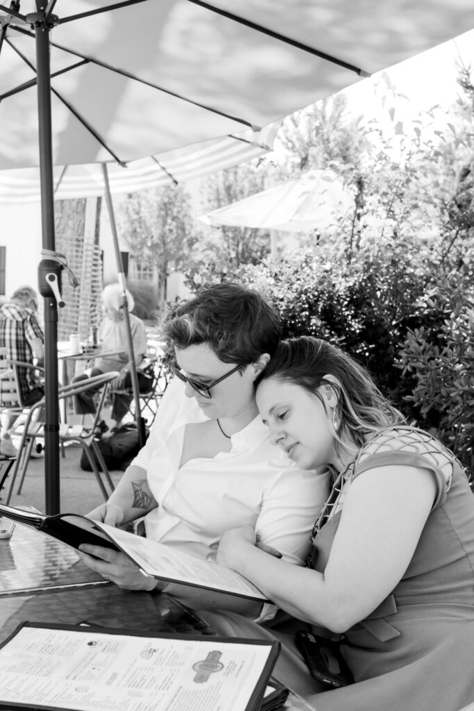 LGBTQIA+ couple elopes, Brunch at Town Diner, candid photos of the couple in black and white