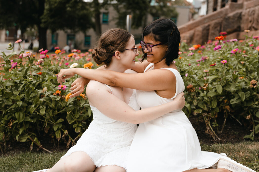 LGBTQIA couple hugs at Cambridge City Hall elopement