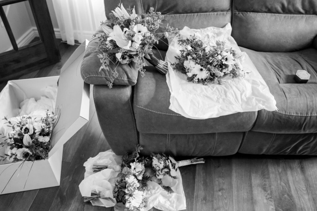 Wedding Bouquets scattered around the living room in black and white
