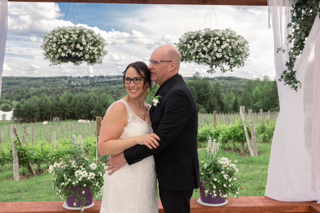 Candid moment of the bride and groom during their couples portraits at their wedding