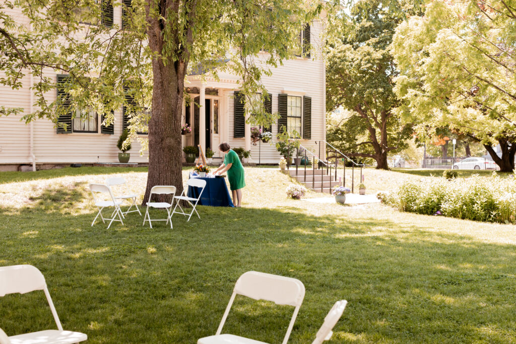 Grooms mother getting the handmade name cards ready for the seating arrangements at the Loring-Greenough House