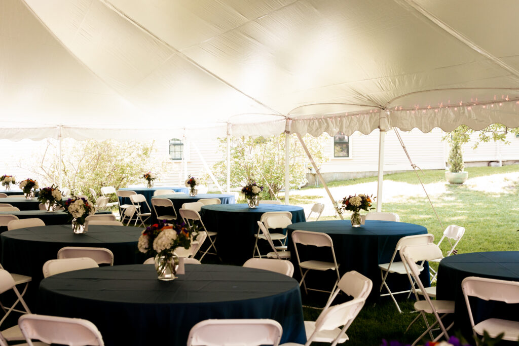 Reception space of a tented wedding at the Loring-Greenough House