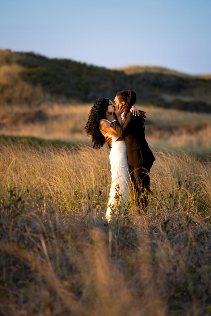 Intimate wedding portraits in the dunes of block island at golden hour