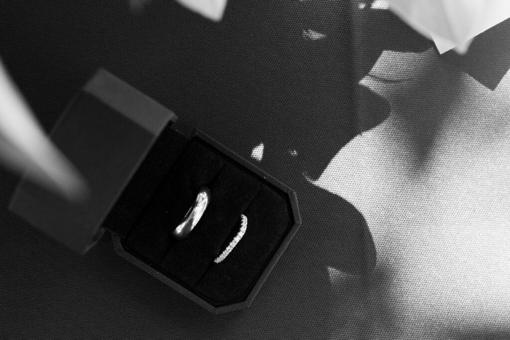 Detail photo of the ring box with the wedding bands in black and white