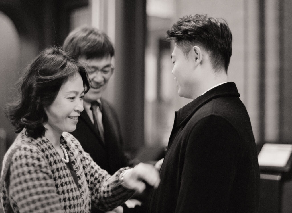 Documentary-style image of the couple waiting outside the clerk’s office inside Cambridge City Hall, taken on film.