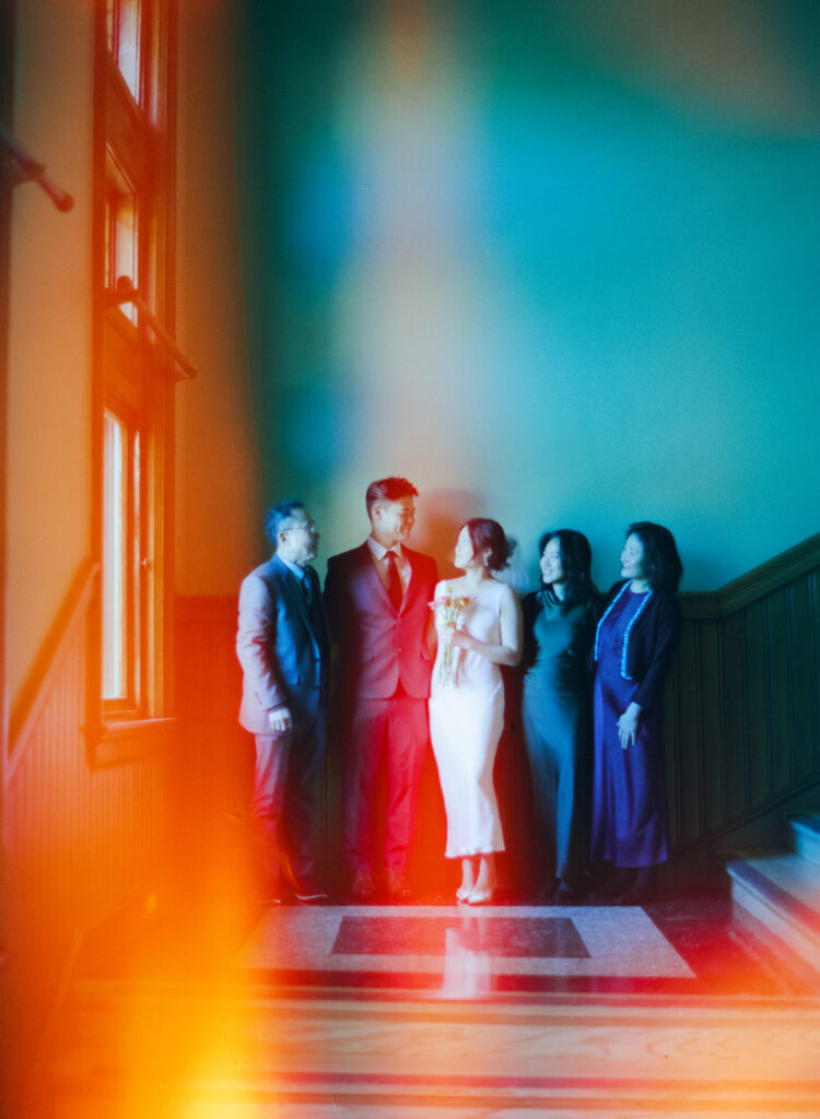 Warm family moment inside the historic Cambridge City Hall—part of Anna and Huimin’s Valentine’s Day elopement on film.