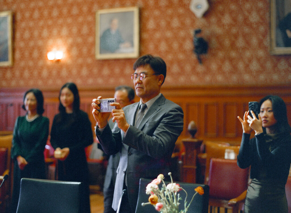 Intimate wedding ceremony at Cambridge City Hall with family present, photographed by a Boston elopement film photographer.