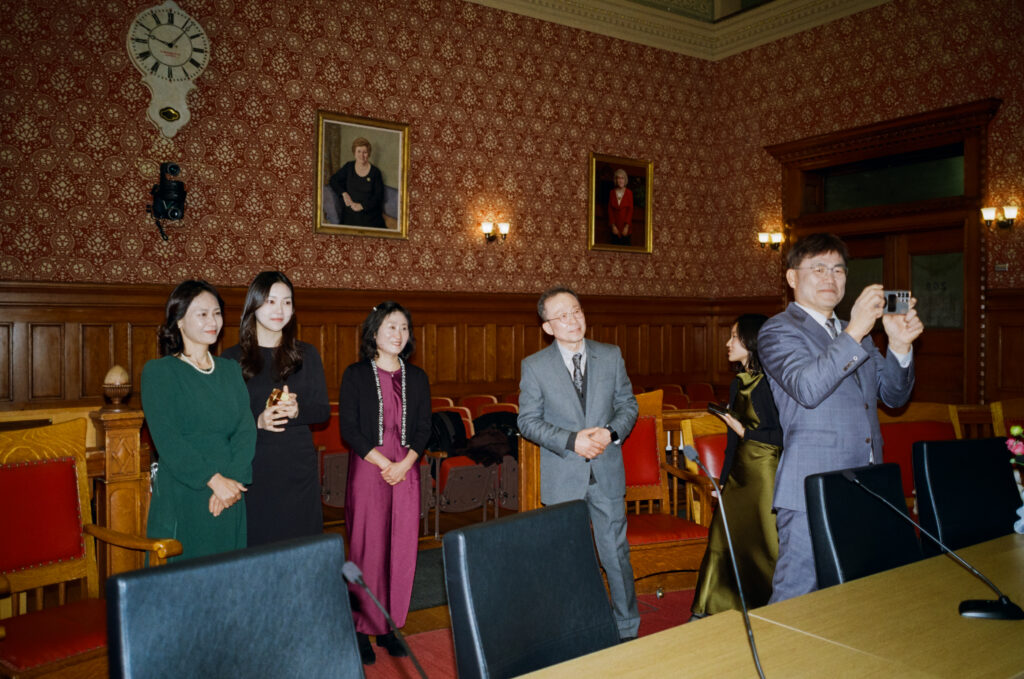 Intimate wedding ceremony at Cambridge City Hall with family present, photographed by a Boston elopement film photographer.