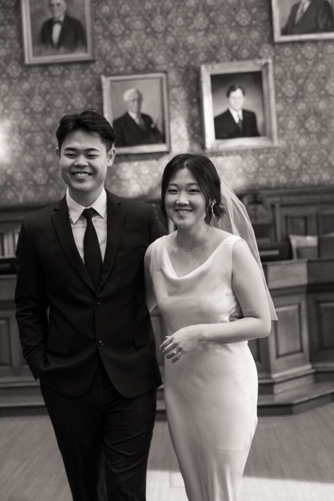 Intimate wedding ceremony at Cambridge City Hall with family present, photographed by a Boston elopement film photographer.