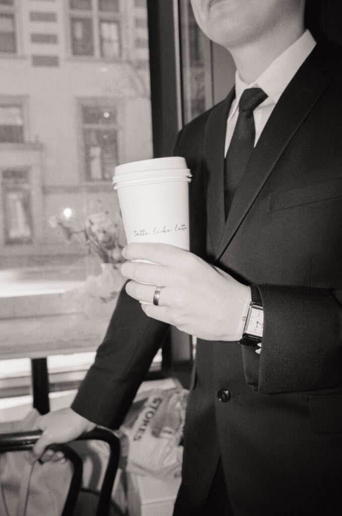 Couple enjoying coffee and pastries together after their Cambridge elopement.