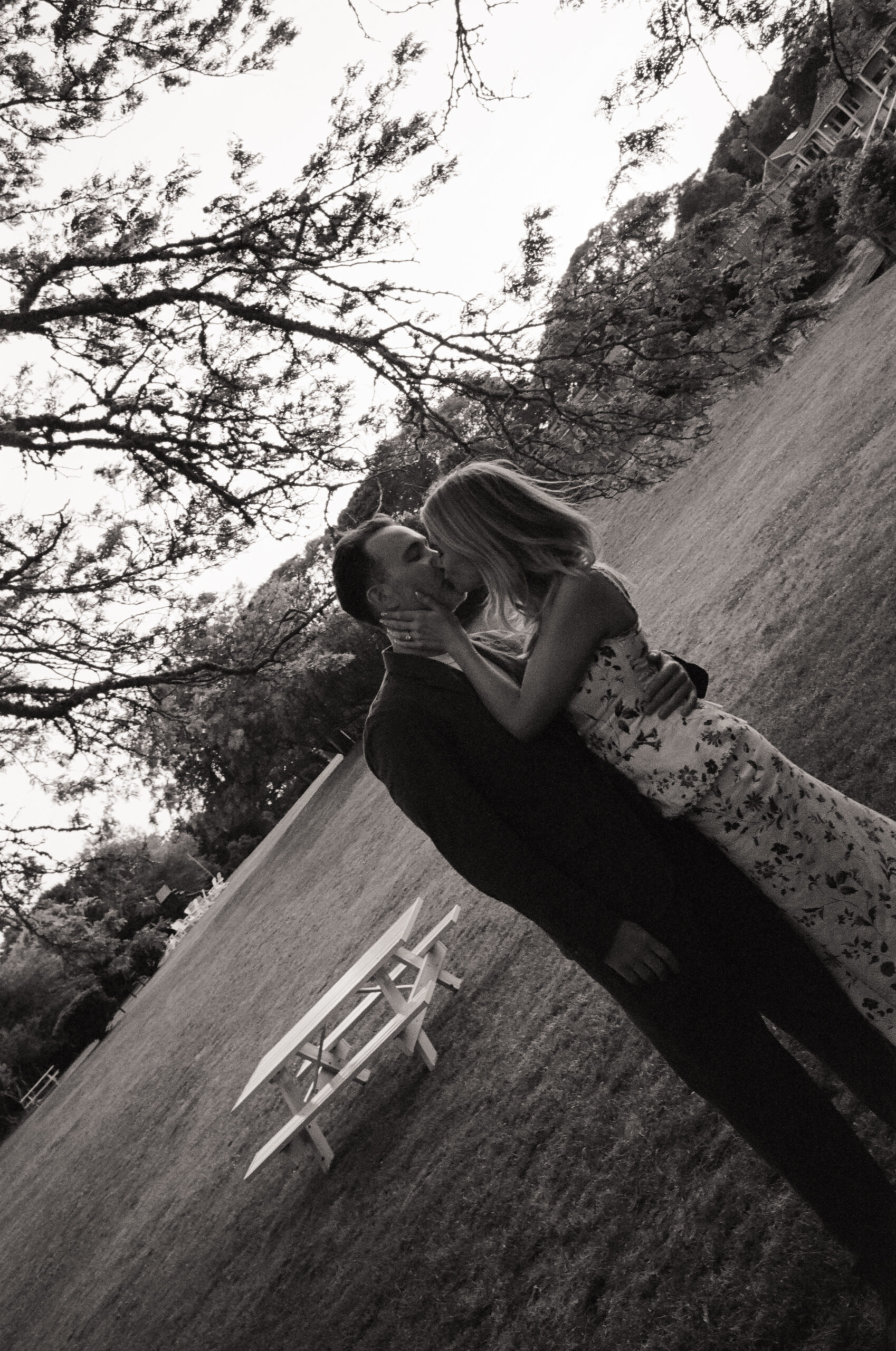 Romantic black and white film portrait of Olivia and Coby kissing at their Martha’s Vineyard wedding rehearsal dinner.