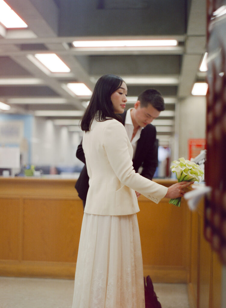 Candid photo of the bride and groom awaiting their Boston City Hall elopement ceremony.