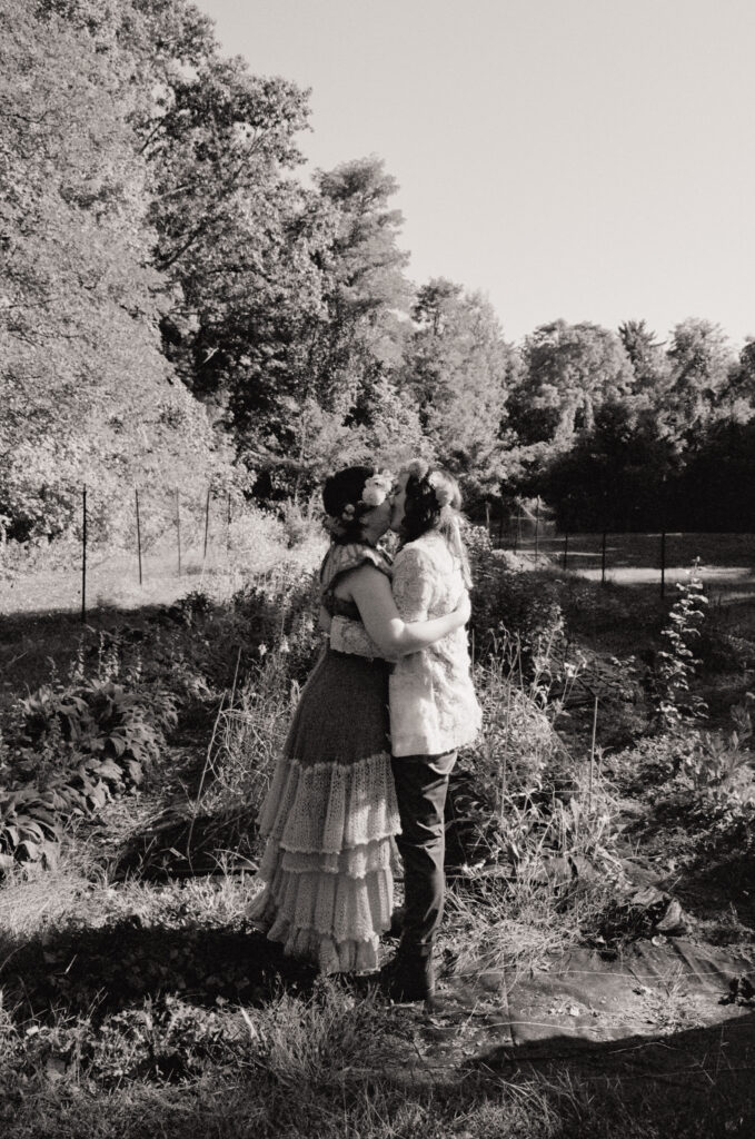 Black and white photograph of wedding ceremony kiss on 35mm. 