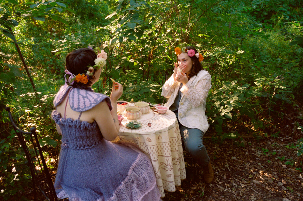 Couple shares appreciation across a meal after their wedding ceremony.