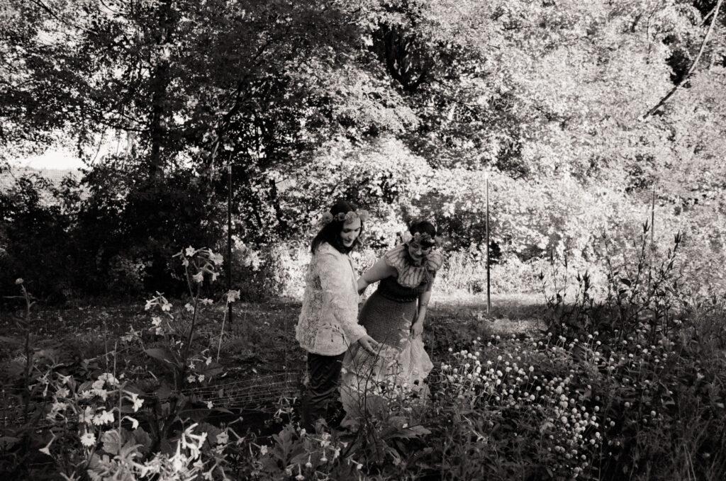 Couple examines the flowers at the grounds of their wedding ceremony. 