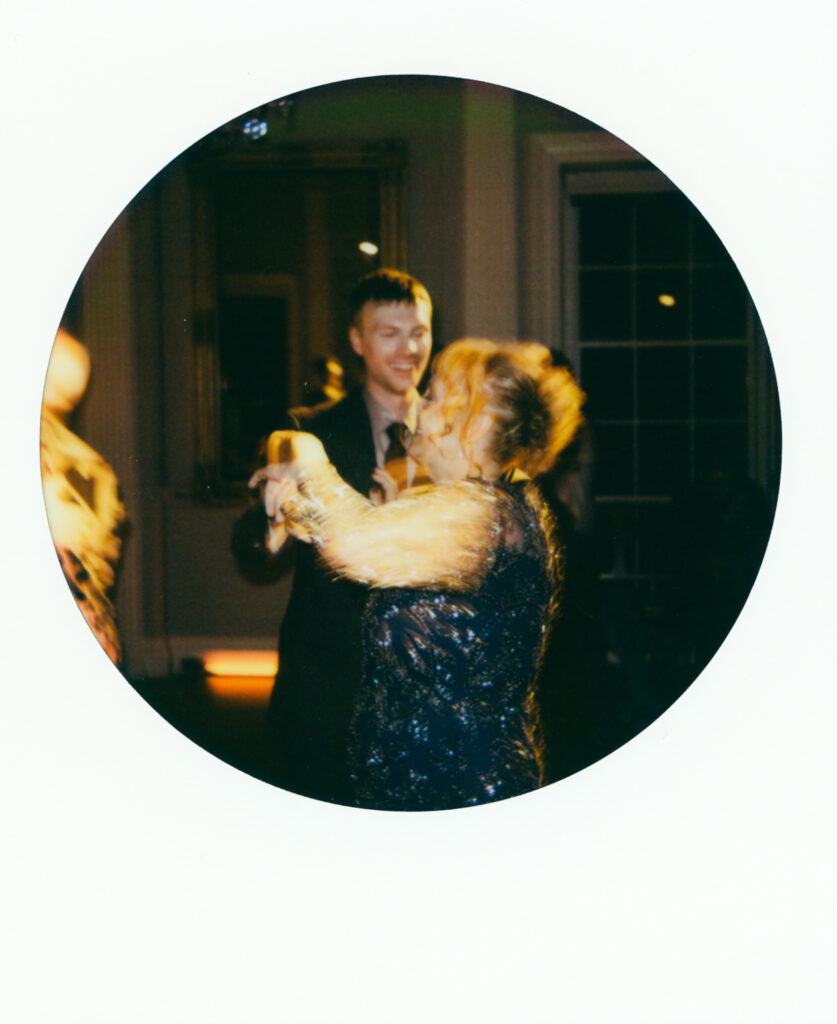polaroid image of mother and son dancing