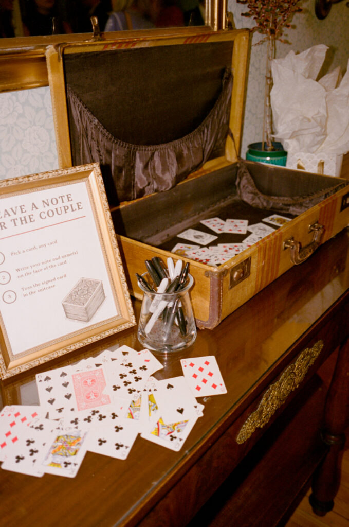 playing cards and a vintage wooden box to leave a not for a couple on their wedding day
