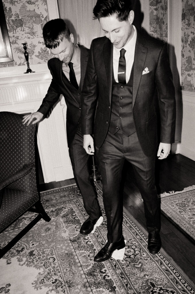 mother and grandmother do The Salt and Bread Tradition with their sons on wedding day
