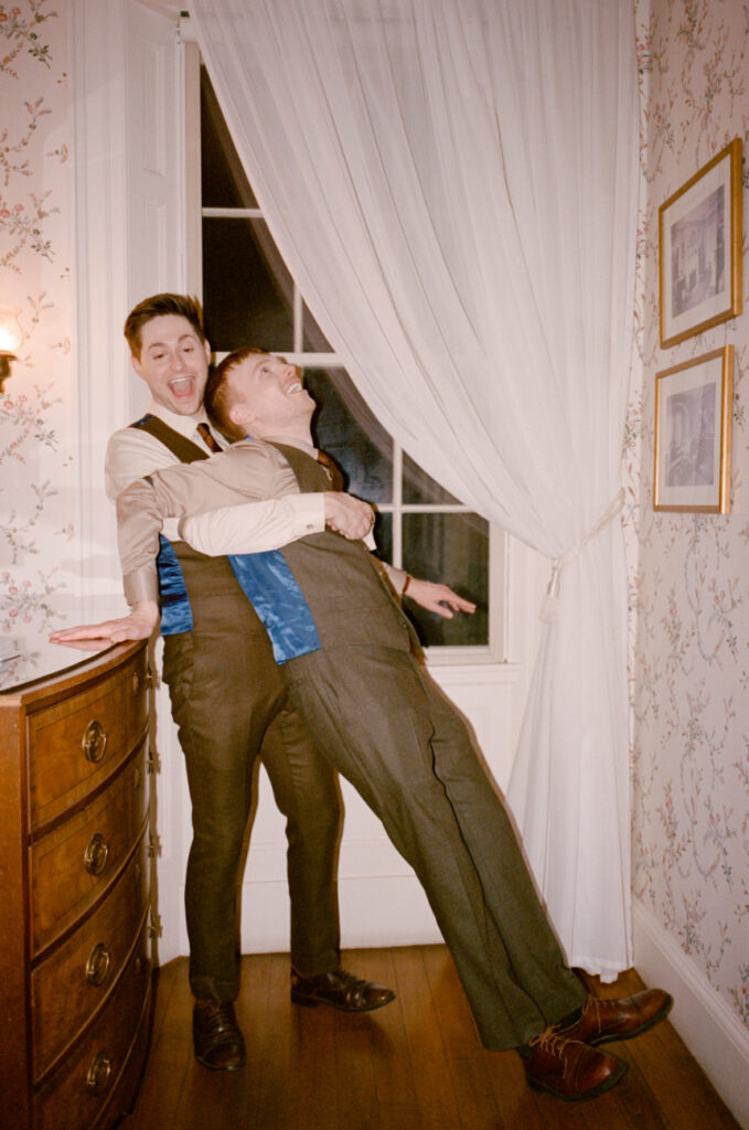 queer grooms being silly and laughing at the Lyman Estate