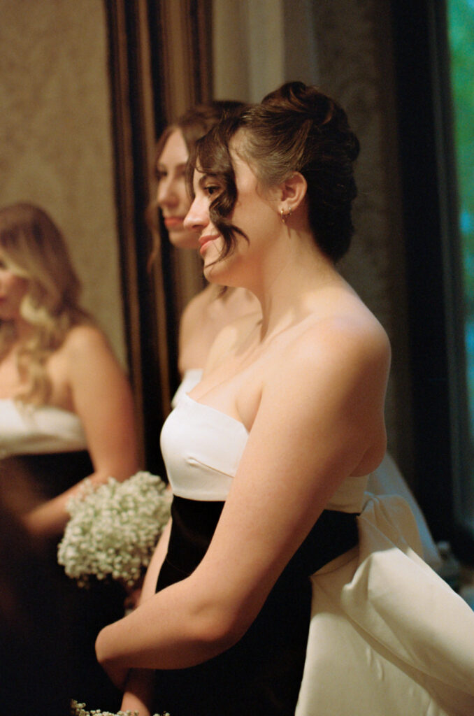 bridesmaids watching bride and groom do the ketuba signing