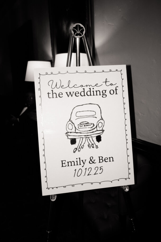 welcome sign for wedding in a black and white photo