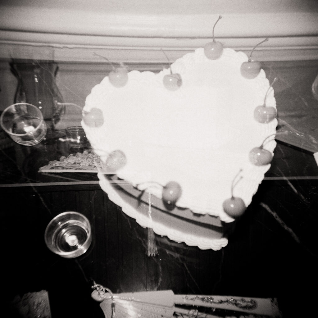 heart shaped wedding cake with cherries