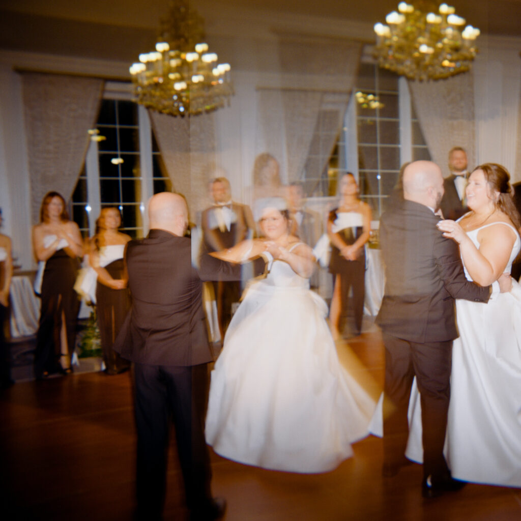 blurry image of bride and groom dancing