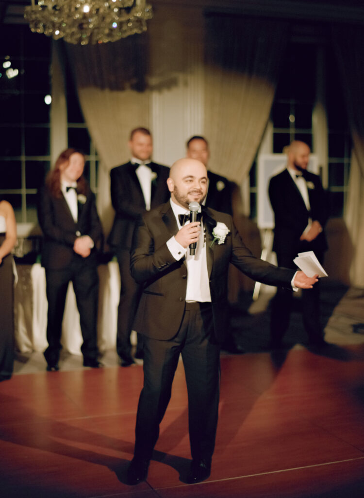 groom doing a speech during wedding ceremony