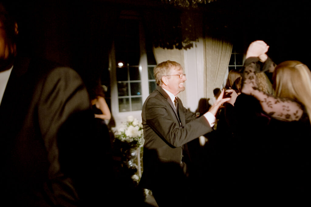 wedding guests smiling and dancing