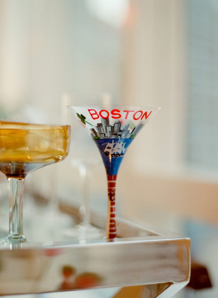 a glass with a picture of the Boston skyline