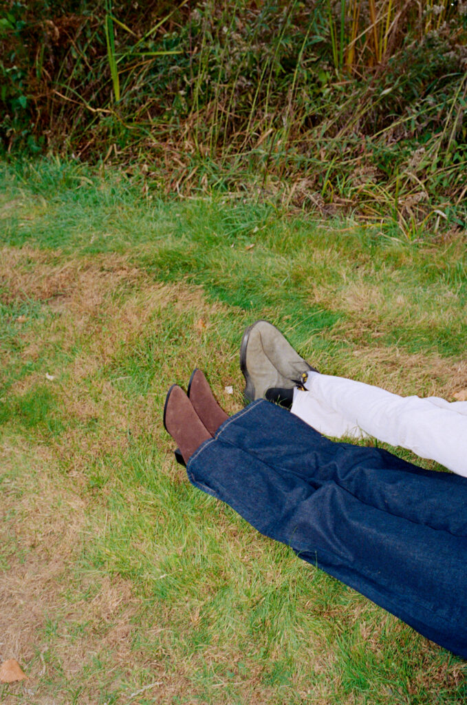 couple's shoes in a field