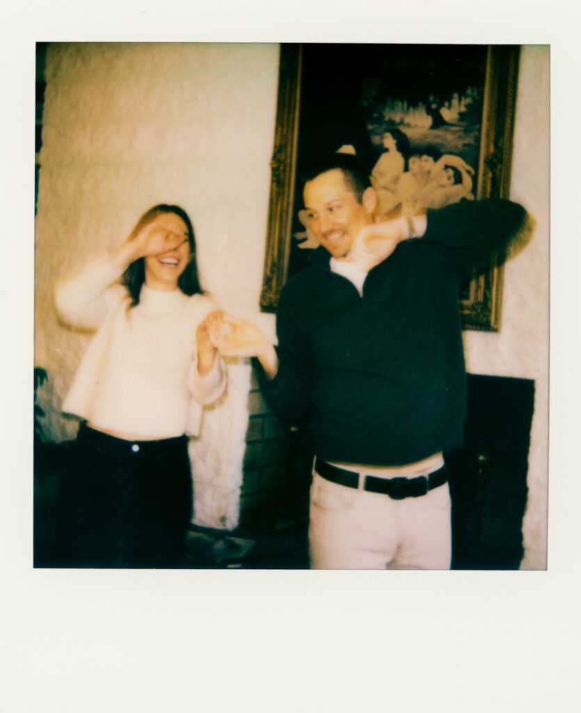 polaroid photo of couple dancing anf smiling at one another