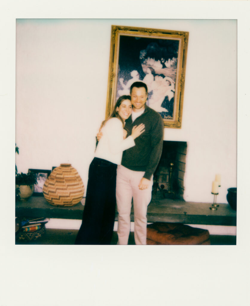 polaroid photo of couple embracing during film engagement photos 