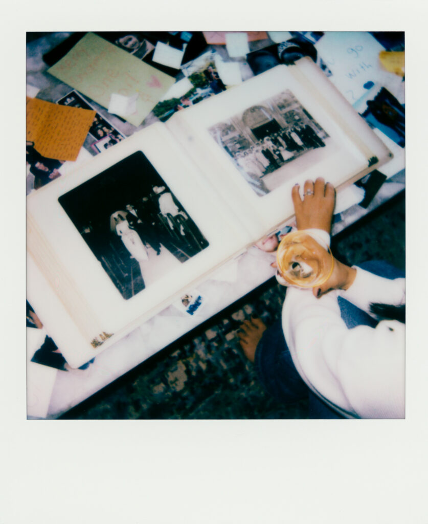 a person holding a photo album at a engagement shoot on film 
